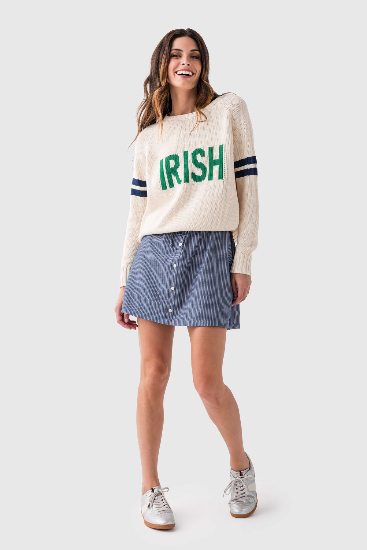Cream knit sweater with green "IRISH" front graphic and navy sleeve stripes