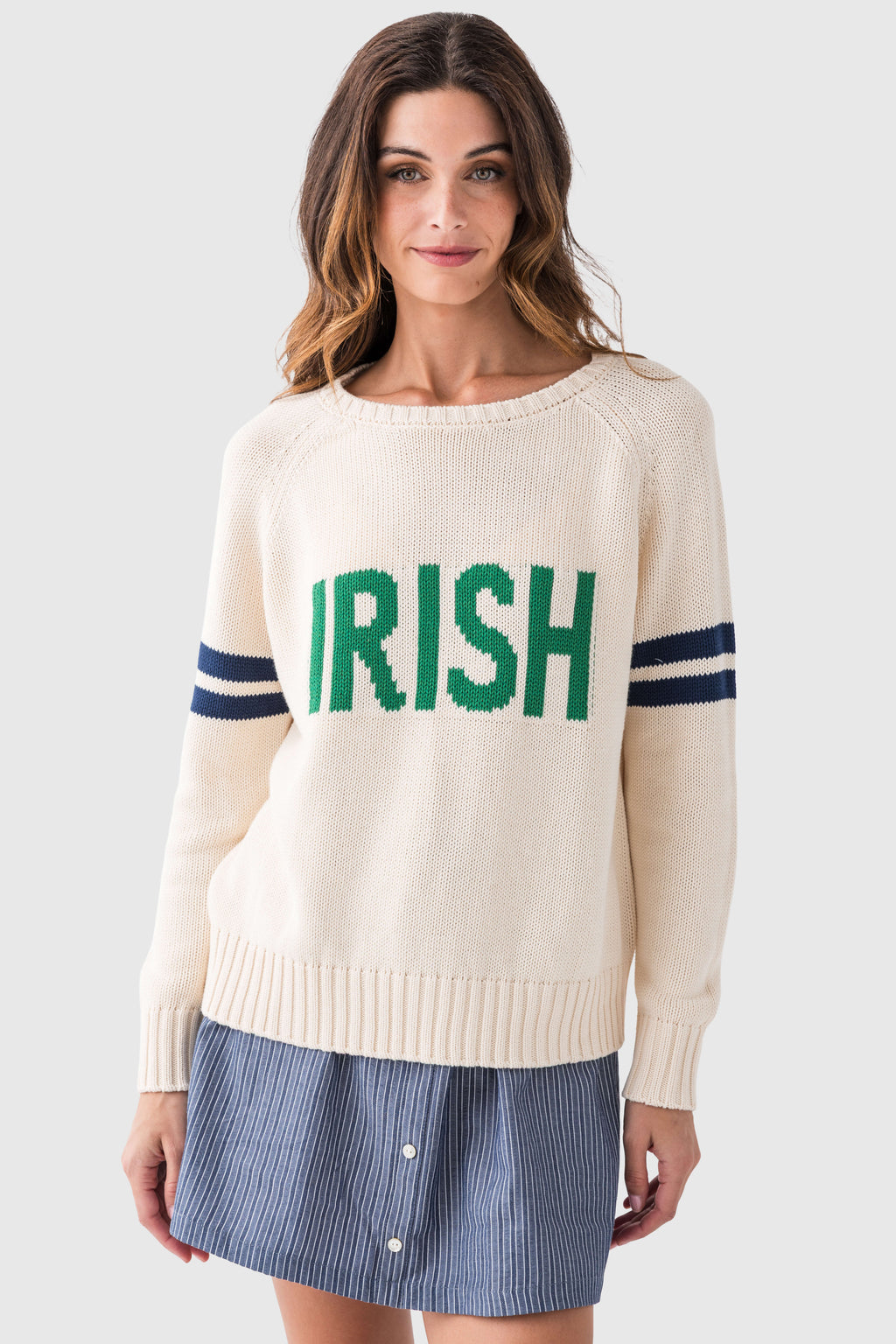 Cream knit sweater with green "IRISH" front graphic and navy sleeve stripes