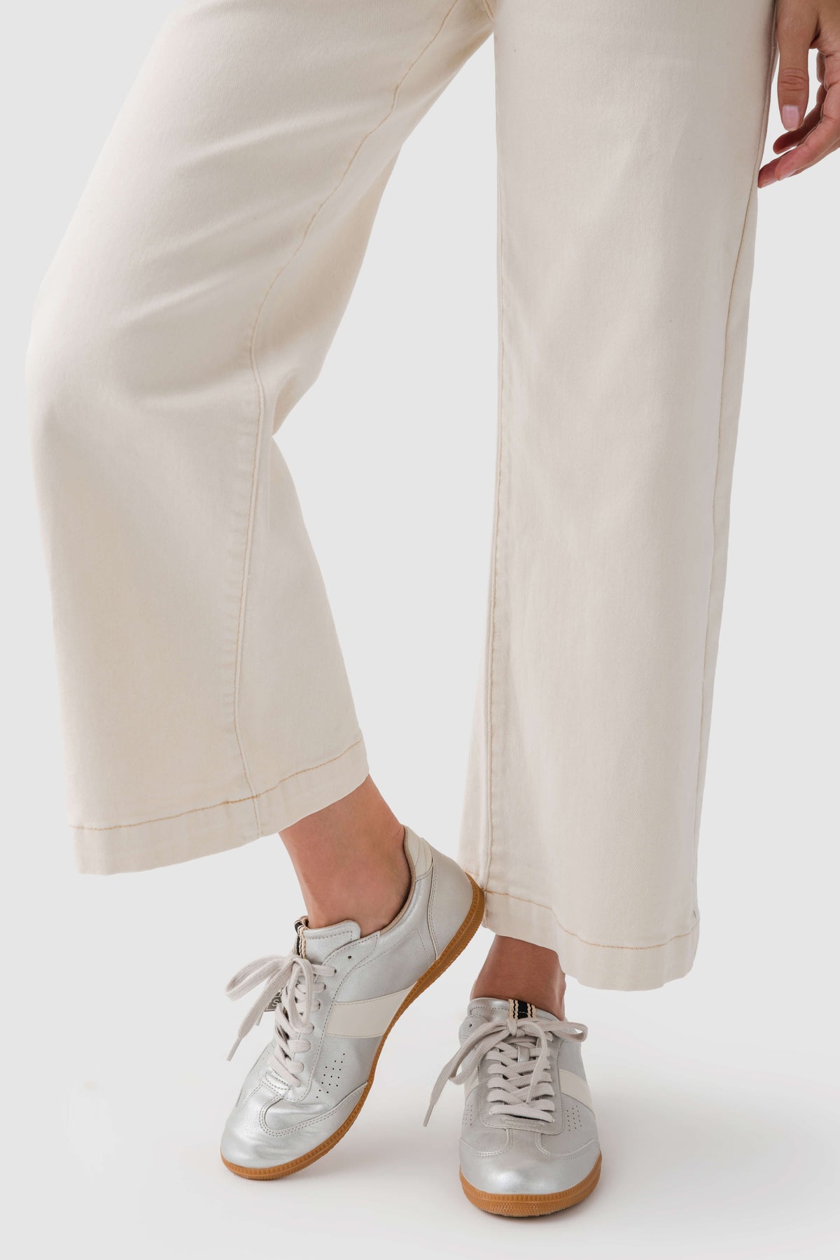 Shu Shop Sydney sneaker front with white laces and tan sole, light upper