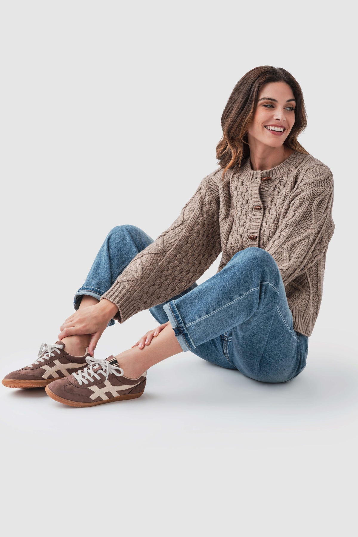 Taupe cable-knit sweater with button-front placket and crew neck, long sleeves