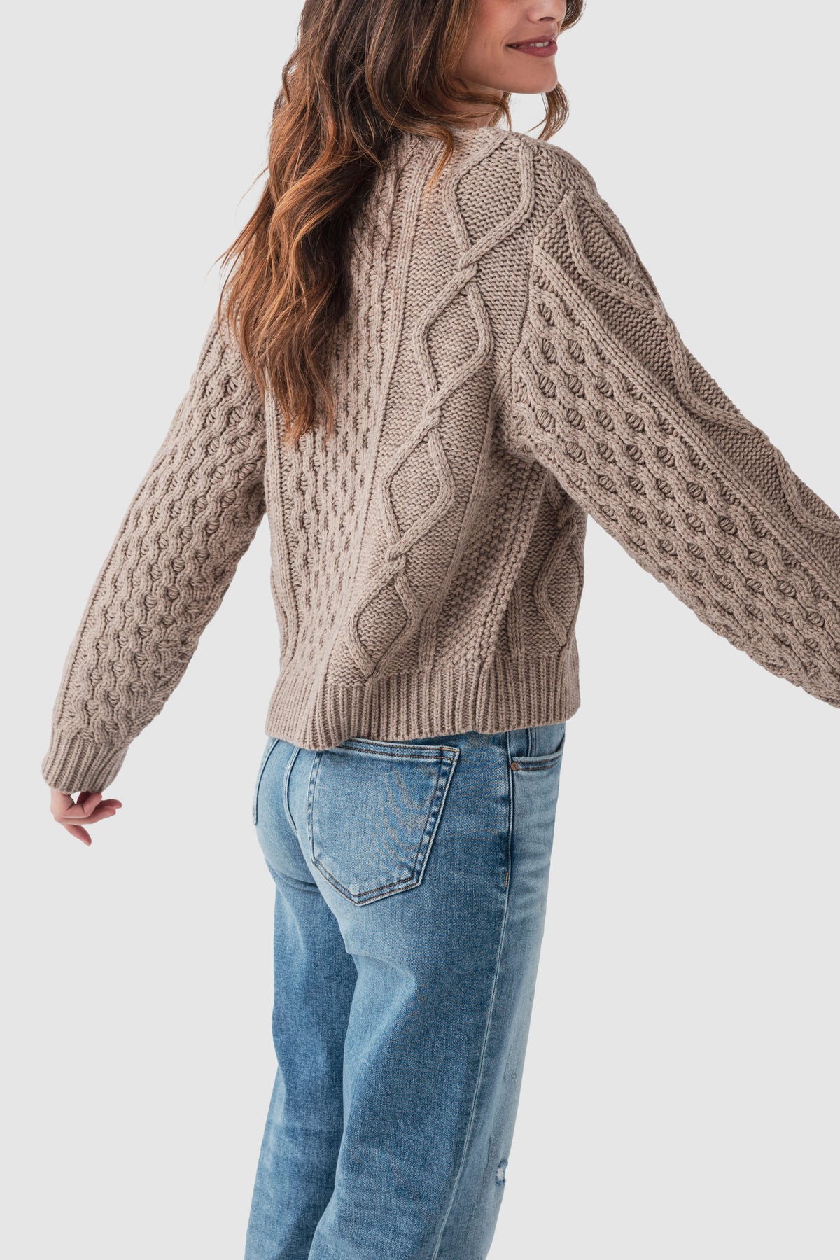 Taupe cable-knit sweater with crew neck and button-front detail, long sleeves