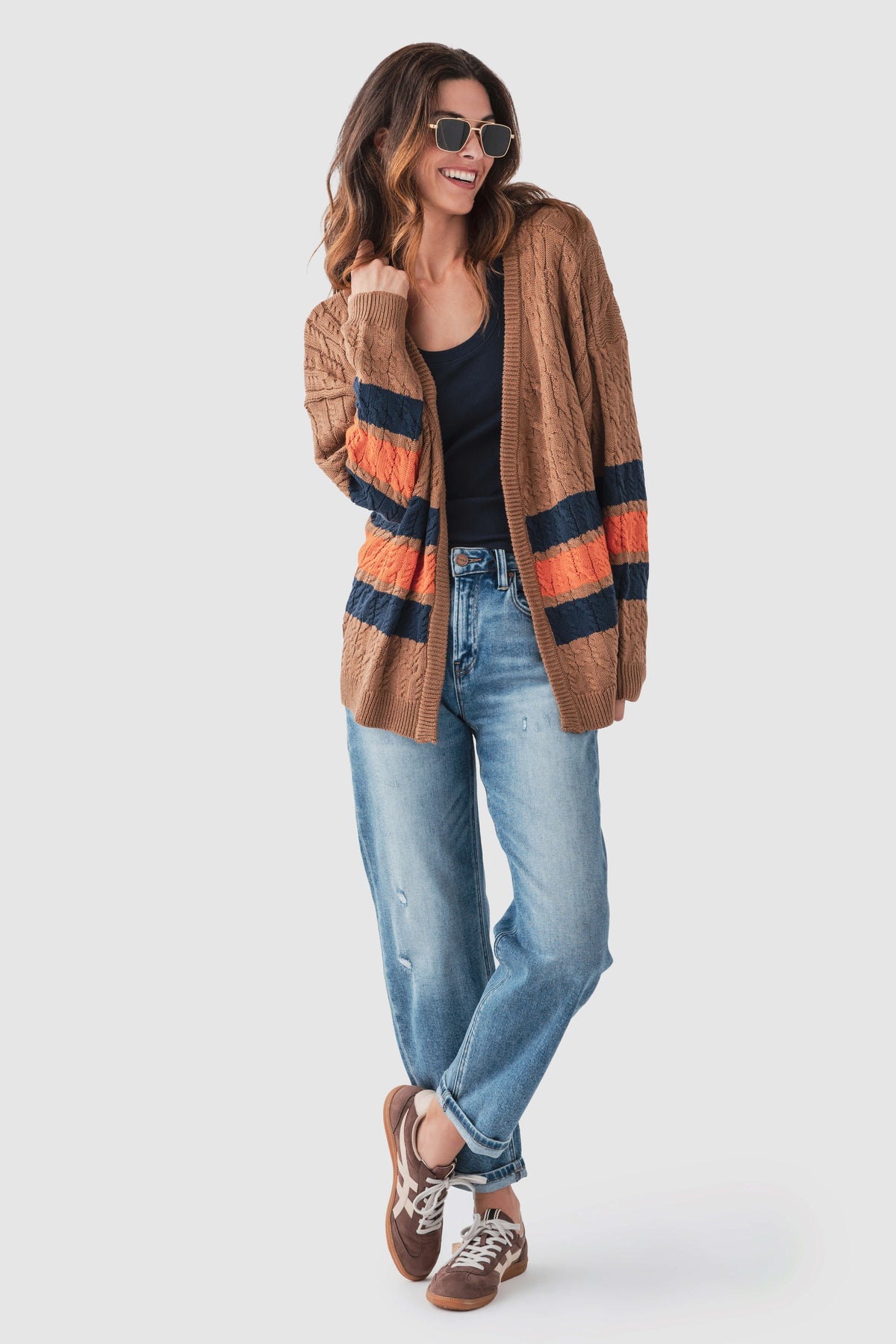 Brown varsity stripe cardigan, cable-knit with open front and navy/orange band details