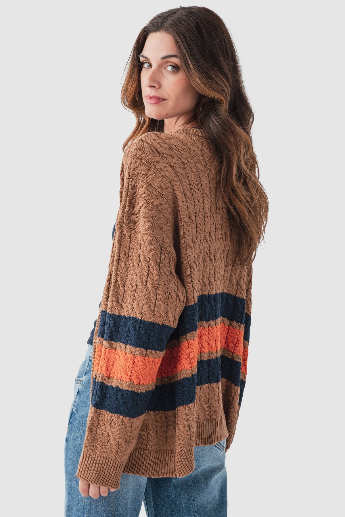 Brown cable-knit varsity cardigan with navy and orange stripe accents on sleeves