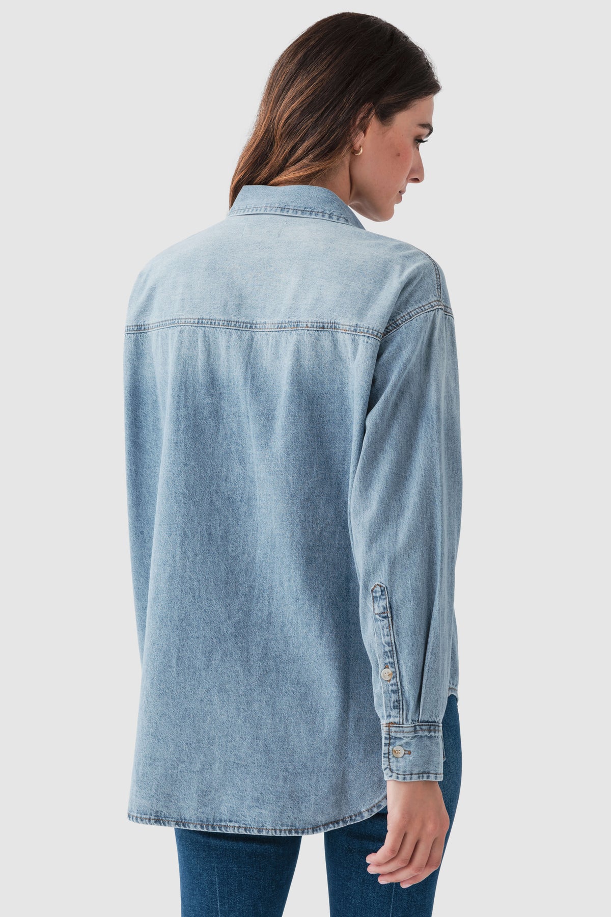 Blue denim button-up top, back view with button placket and button cuffs