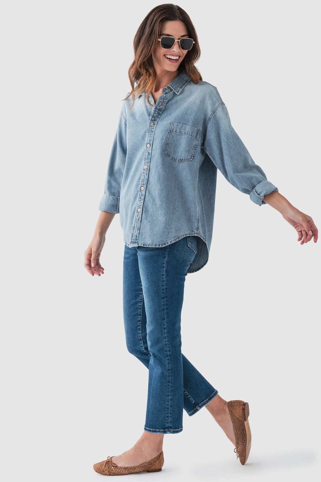 Blue denim button-up top with chest pockets and button front