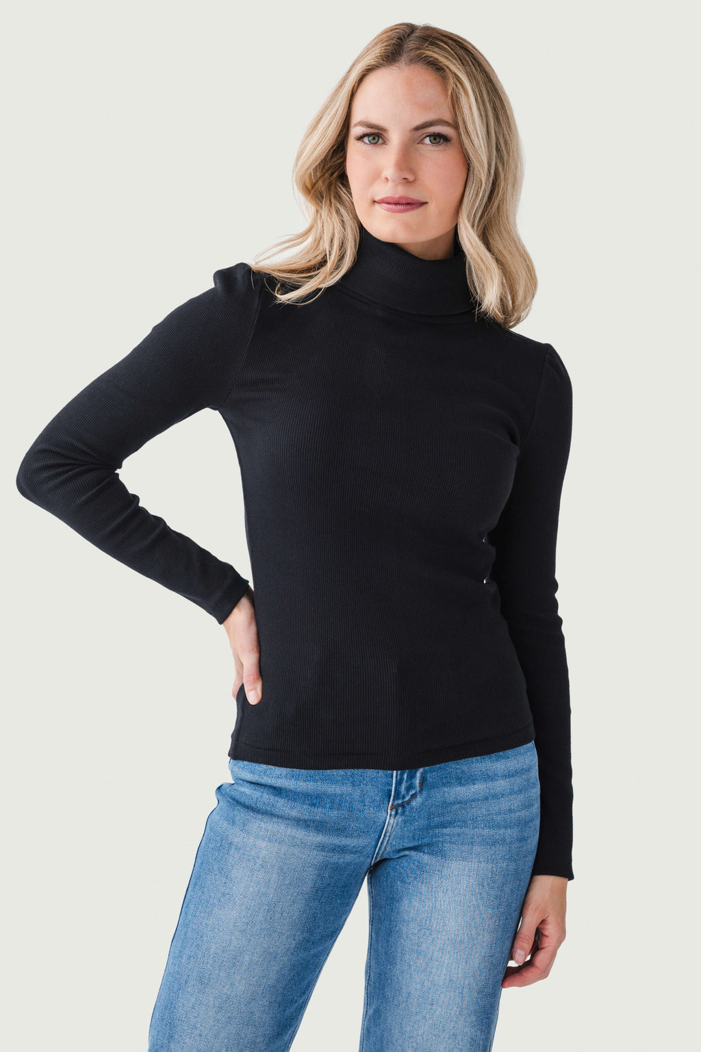 Black long-sleeve turtleneck top, fitted knit