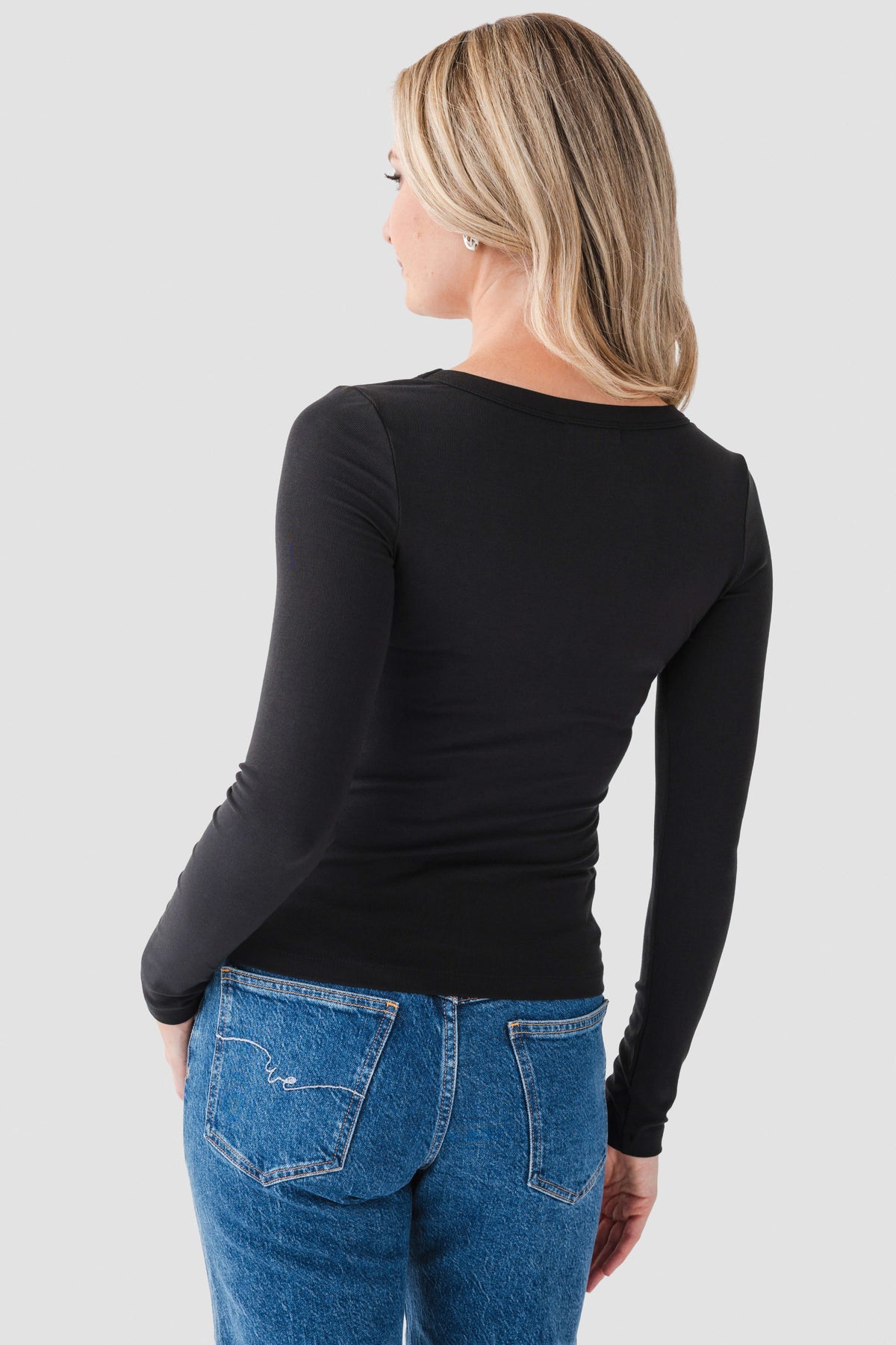 Black scoop-neck second skin top, long sleeves, back view