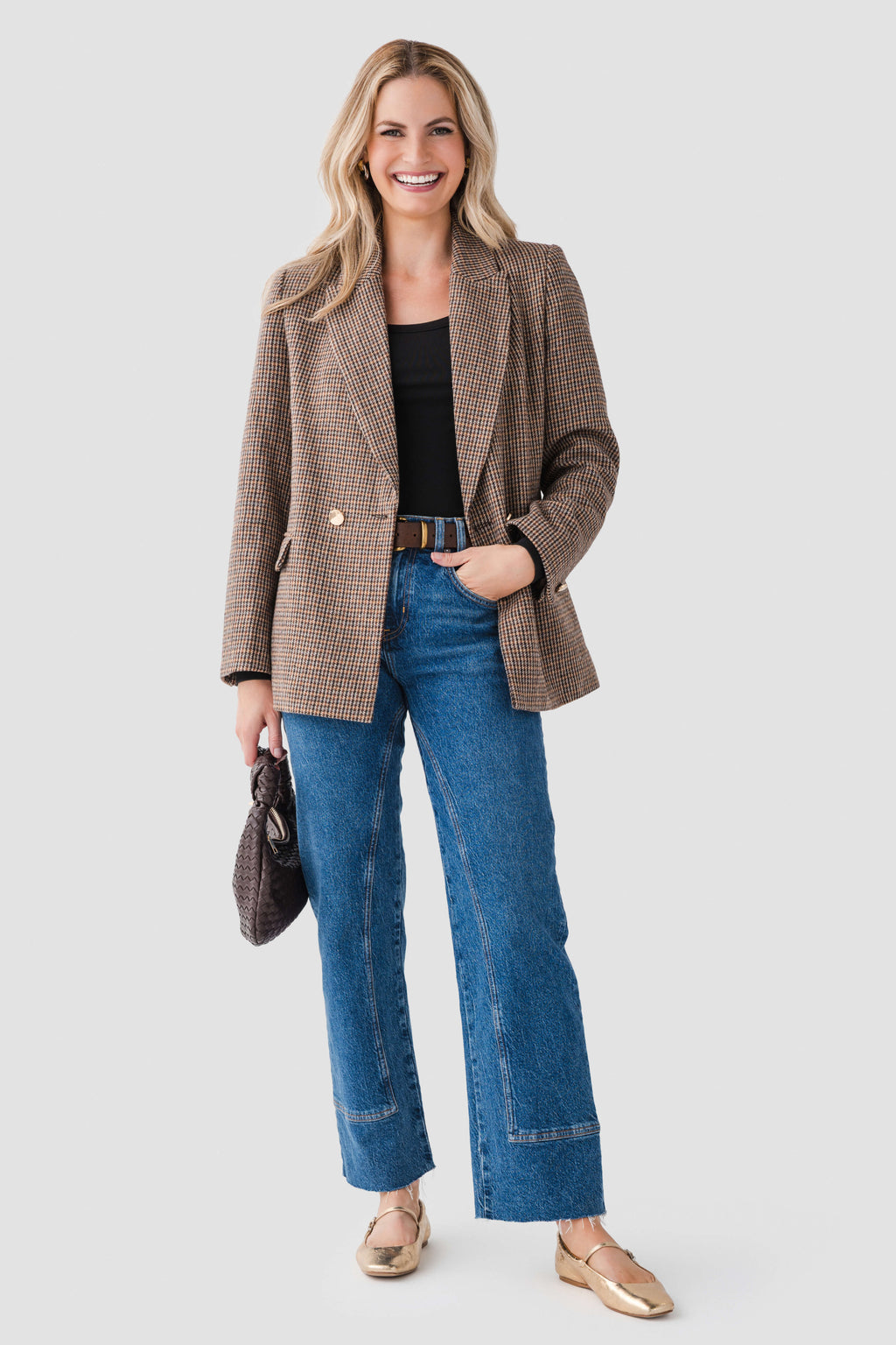 Black scoop-neck long-sleeve top under textured jacket