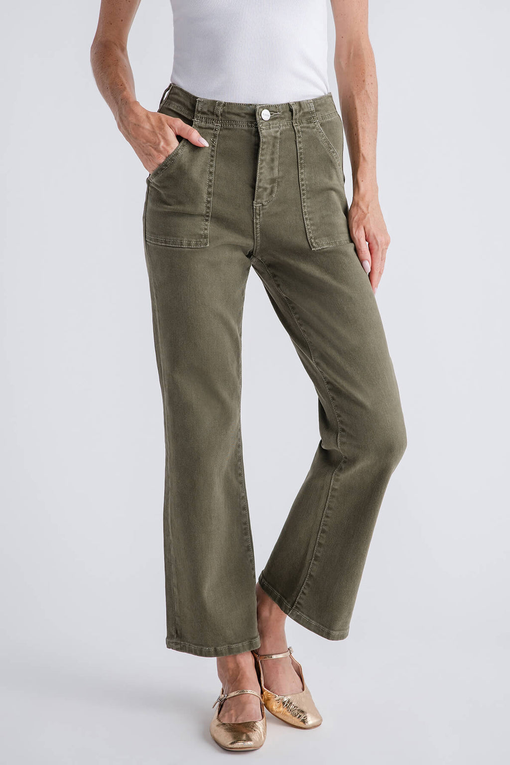 Ankle flare jeans in olive green with front pockets, button closure, and belt loops
