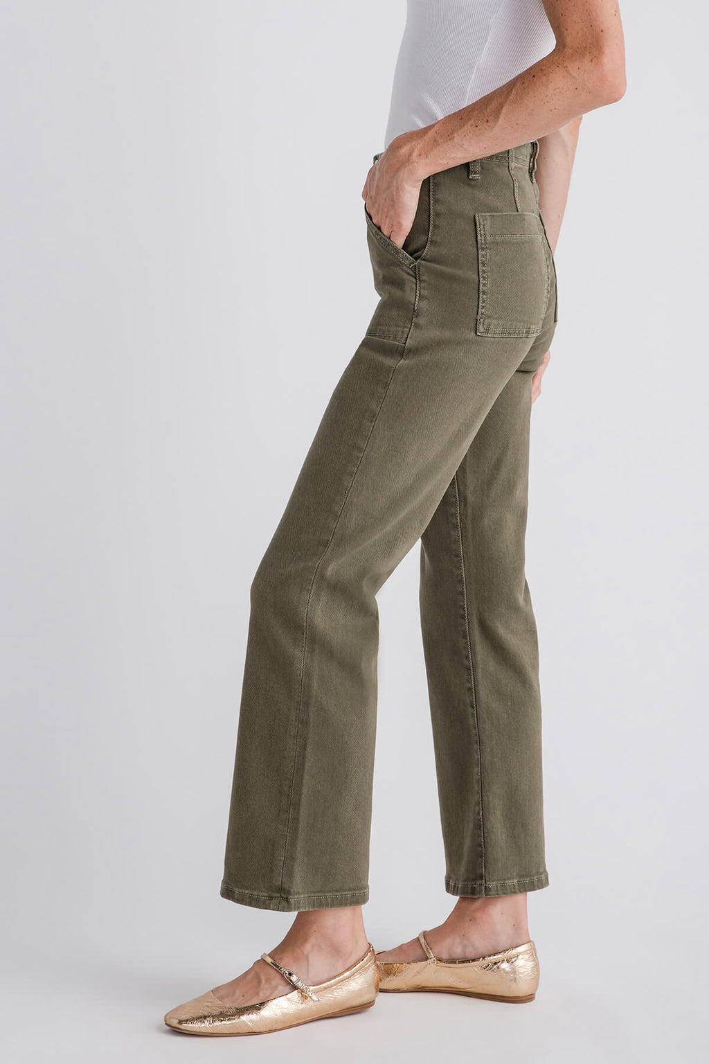 Side view olive green ankle flare jeans with whisker seams and cuffed straight-leg hem