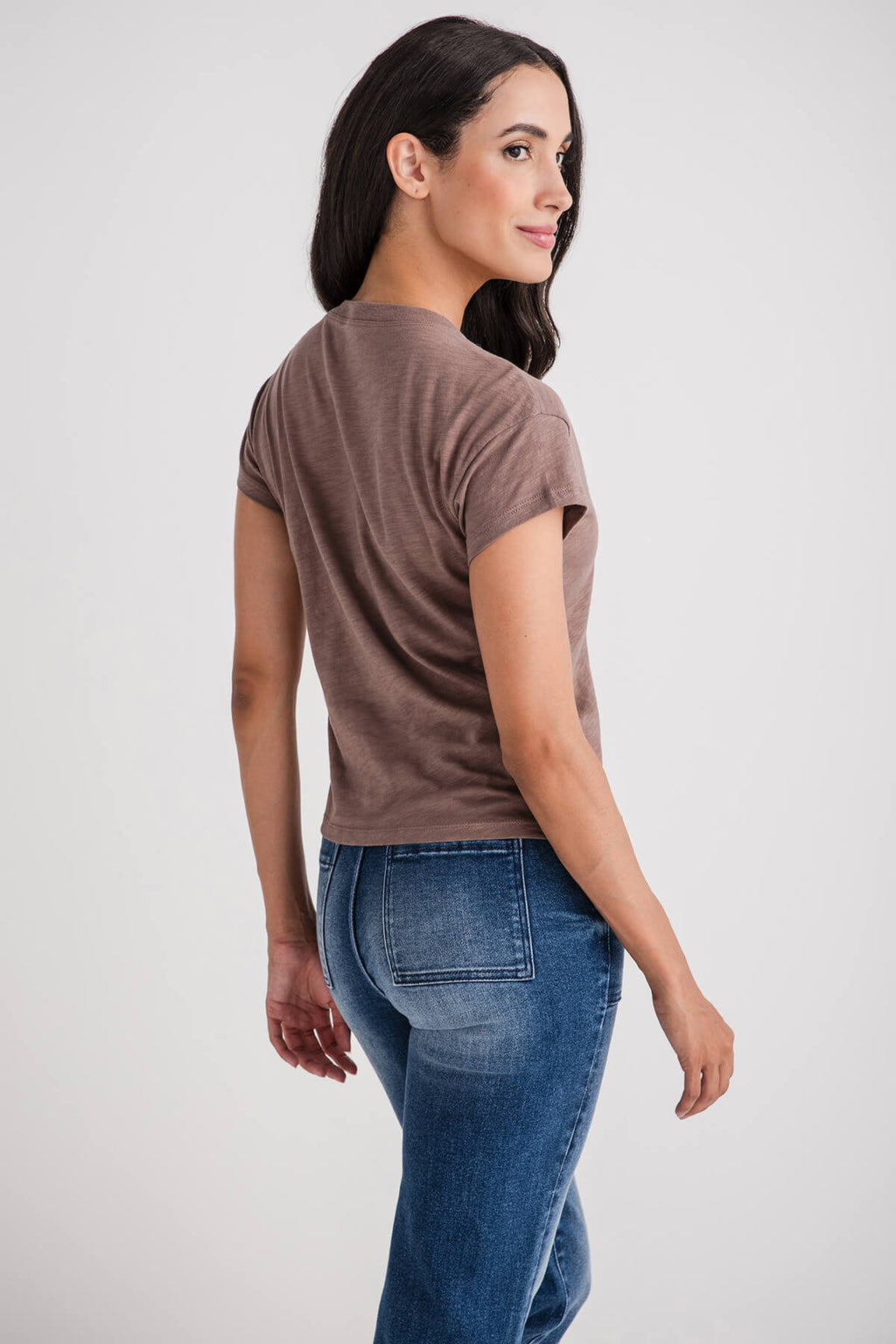 Brown modern slub tee with short sleeves and crew neck, worn with blue jeans