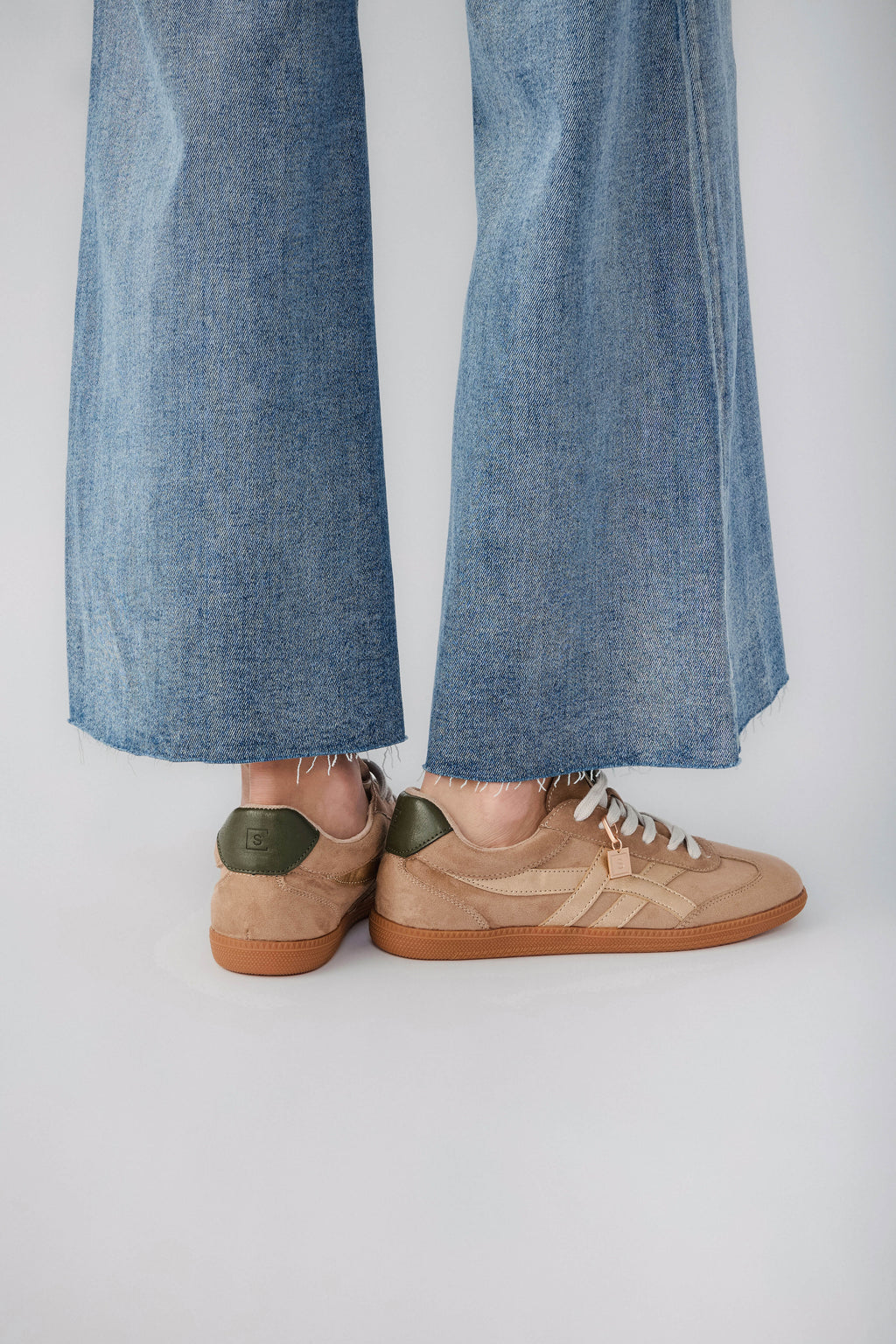 Mink suede low-top sneaker with white laces and tan gum sole, heel detail