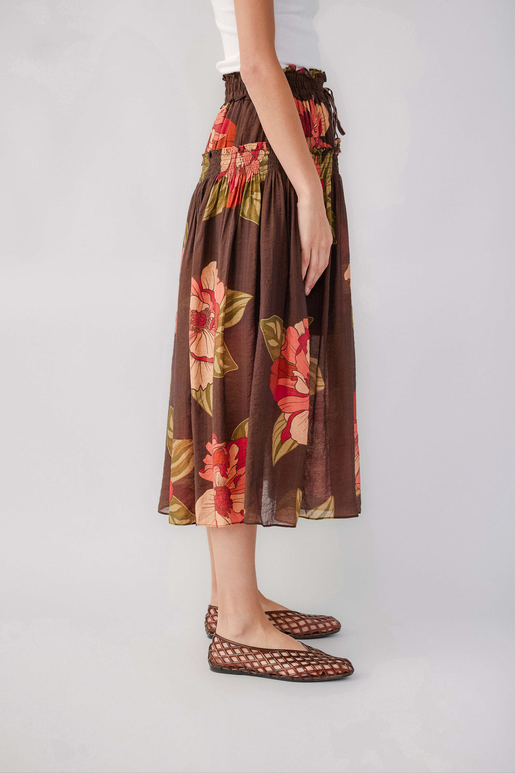 Brown floral maxi skirt with elastic waist and gathered drape