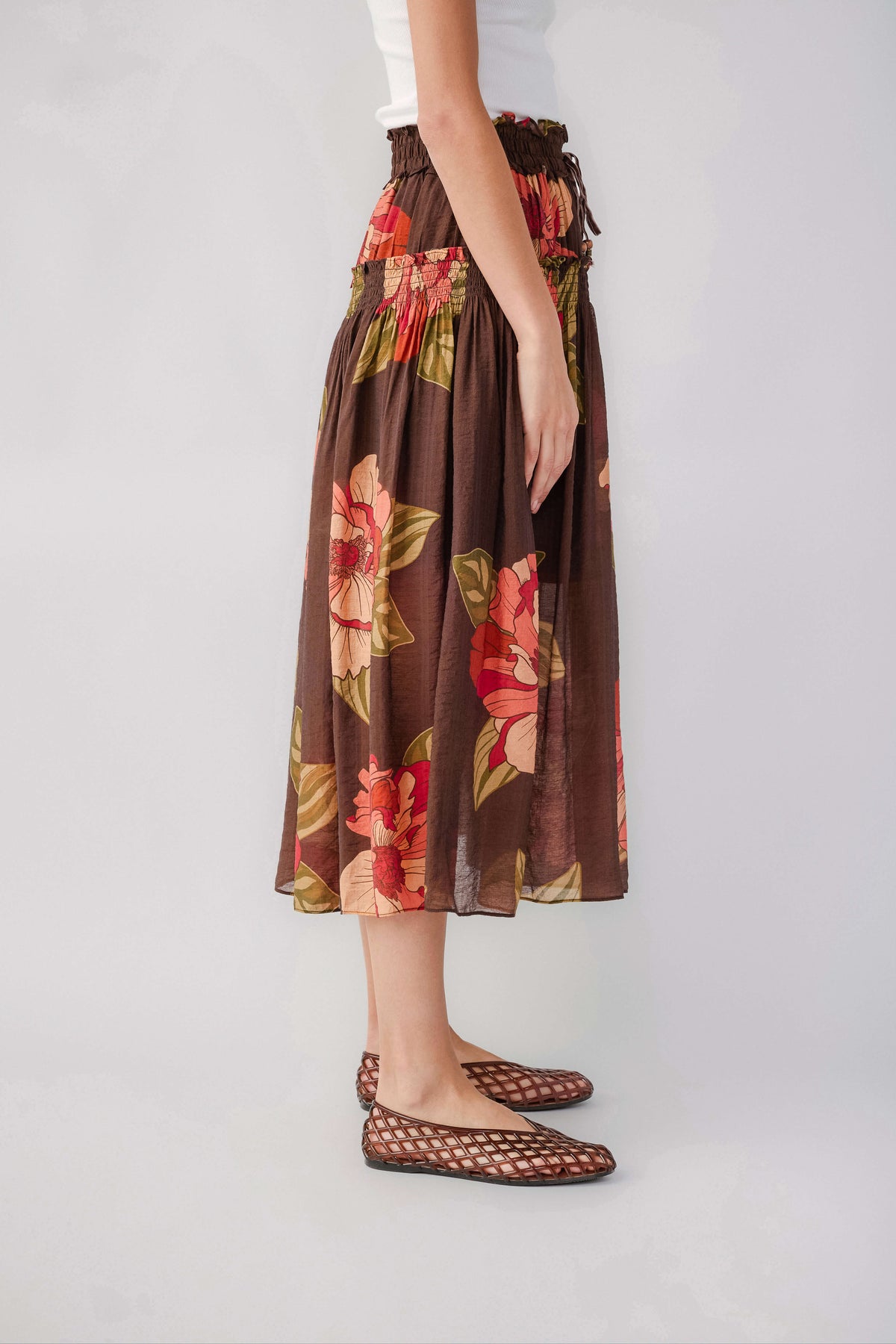 Brown floral maxi skirt with elastic waist and gathered drape