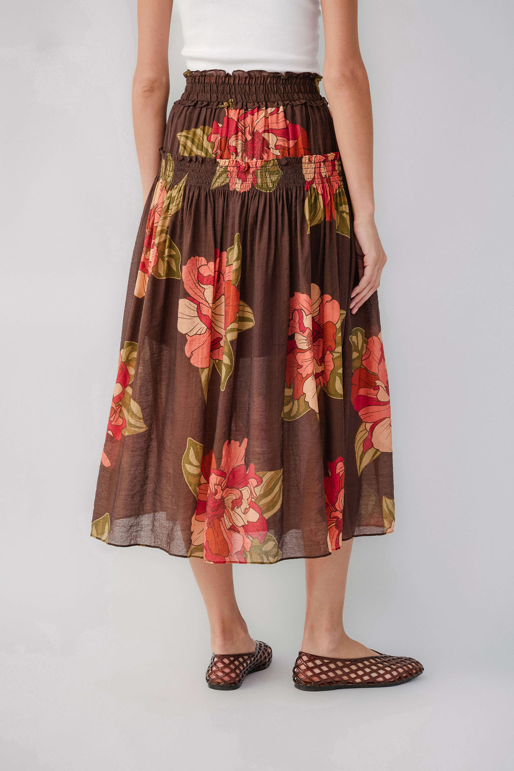 Brown floral maxi skirt with elastic smocked waistband and gathered skirt