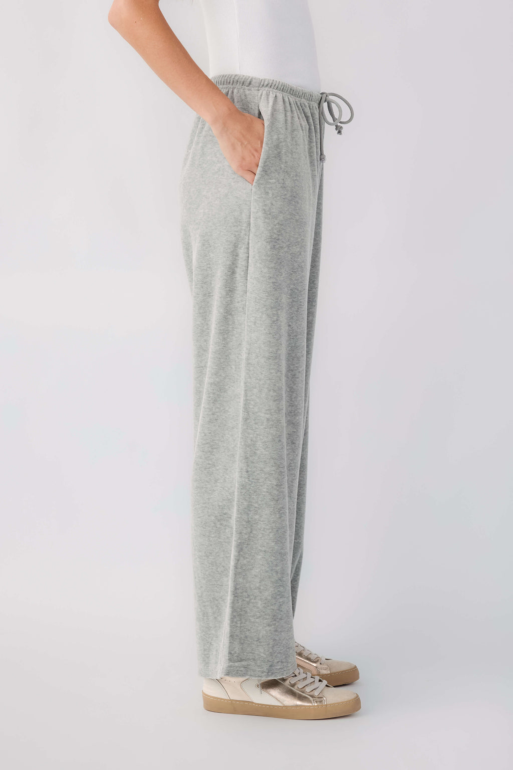 Grey velour wide-leg pants, side view; drawstring elastic waist