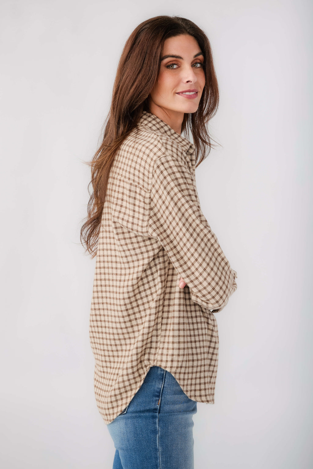 Tan and brown plaid button-up shirt with long sleeves and front buttons
