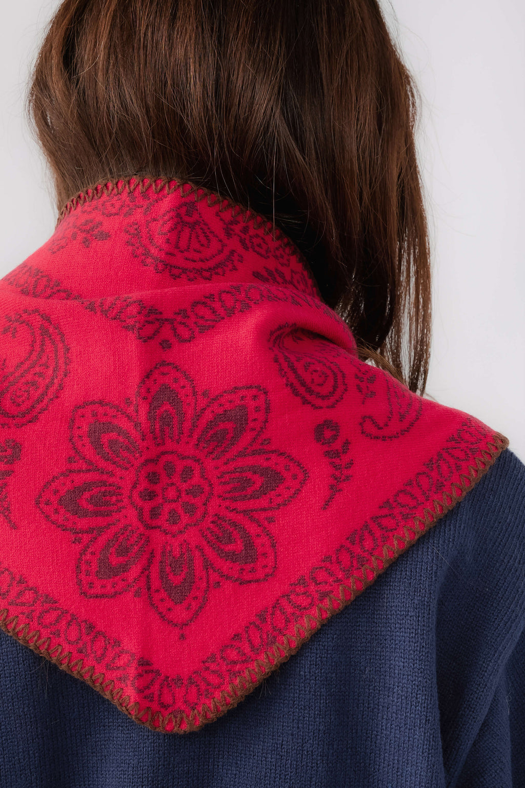 Free People knitted triangle scarf back, vivid red paisley fabric panel