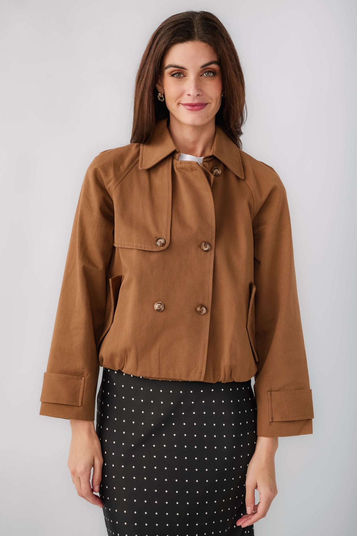 Brown cropped trench jacket front view with point collar and double-breasted closure