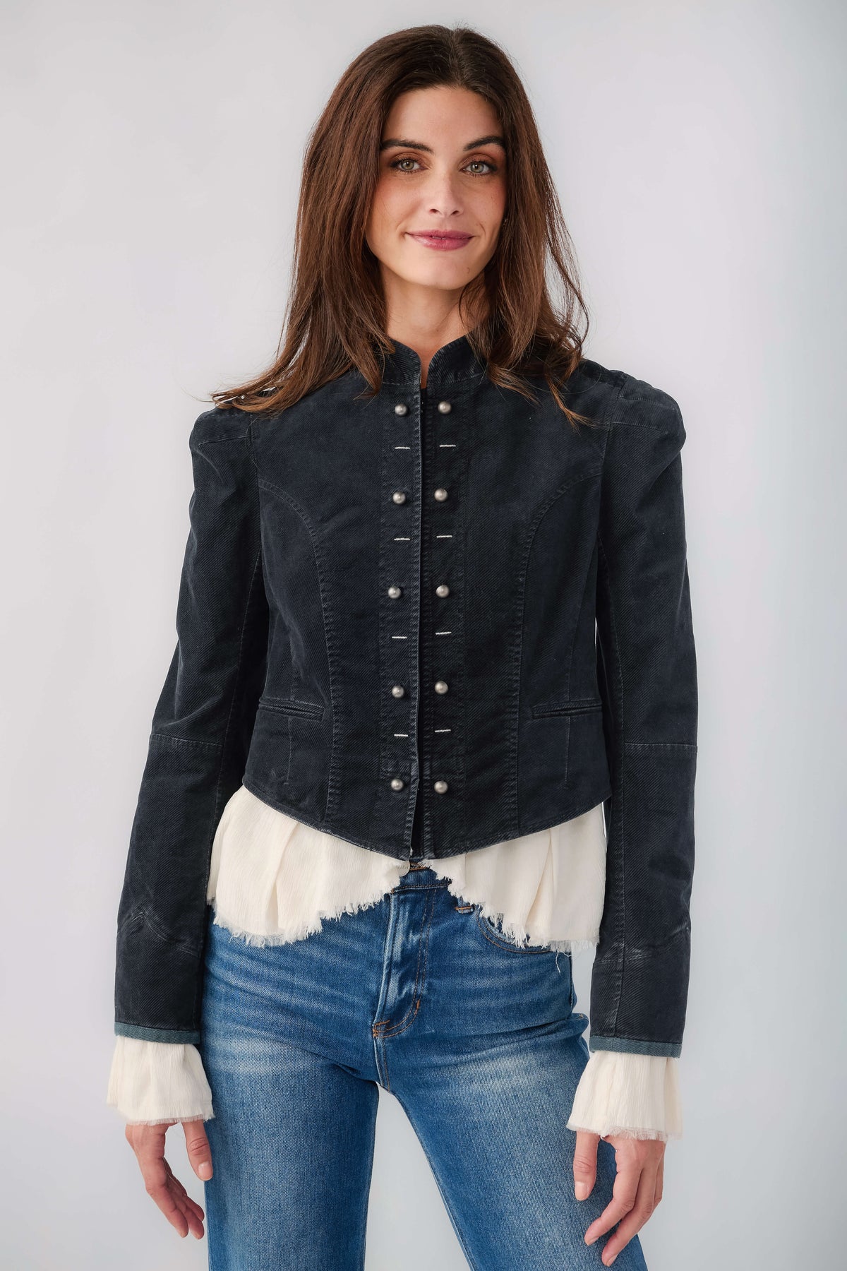 Black denim blazer with button front and white ruffle hem and cuffs