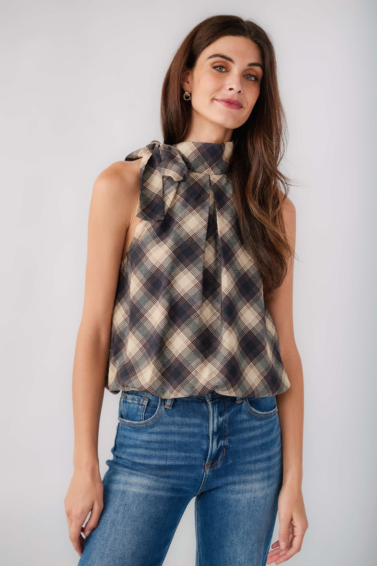 Plaid halter top with sleeveless cut and tied neck, navy and cream tones