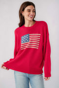 Red crewneck sweater with American flag graphic and ribbed knit hem