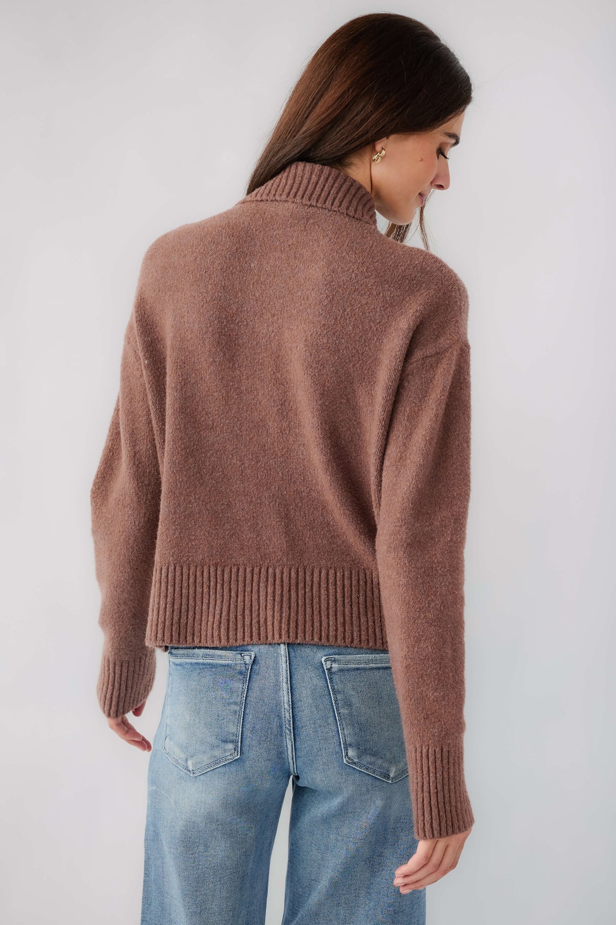 Brown knit polo sweater back view with ribbed hem and cuffs, buttoned collar