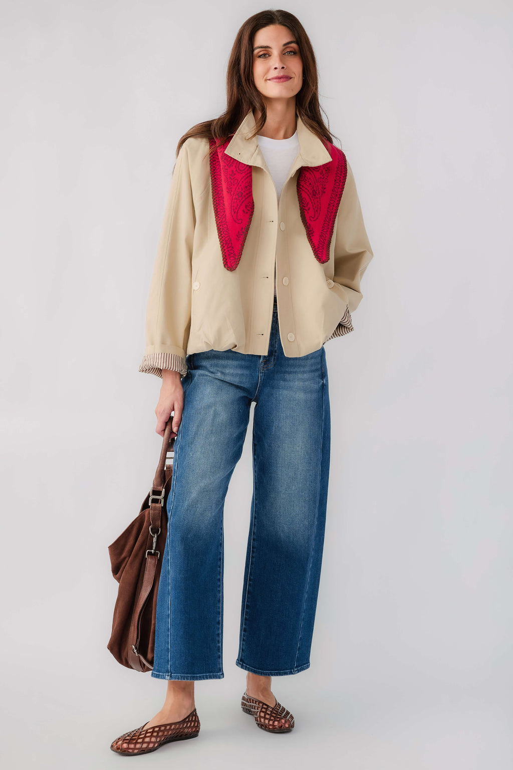 Light beige cropped button-front jacket with stand collar and red inner trim