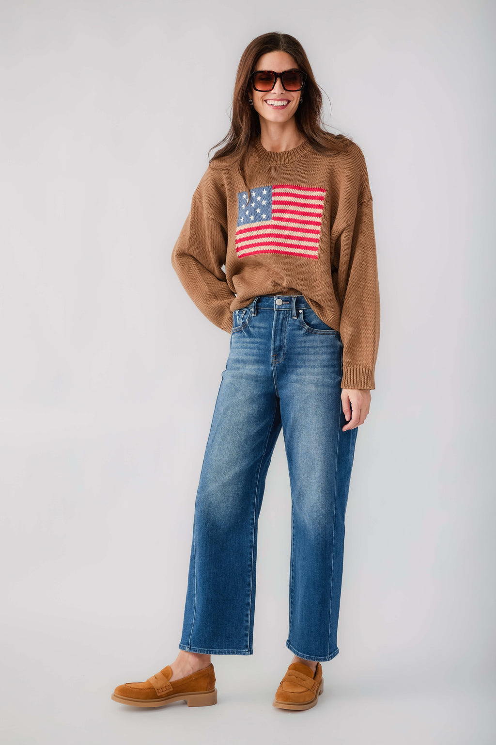 Olive brown crewneck sweater with American flag graphic and ribbed knit cuffs