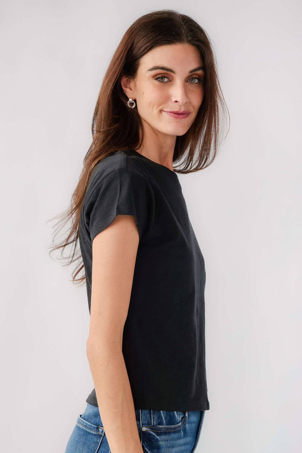 Women's black short-sleeve slub tee, side view