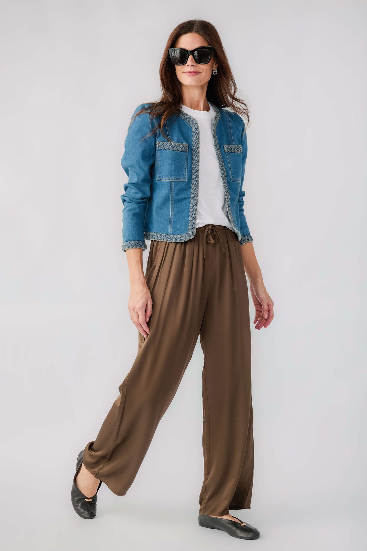 Medium wash denim jacket with braided trim and chest patch pockets