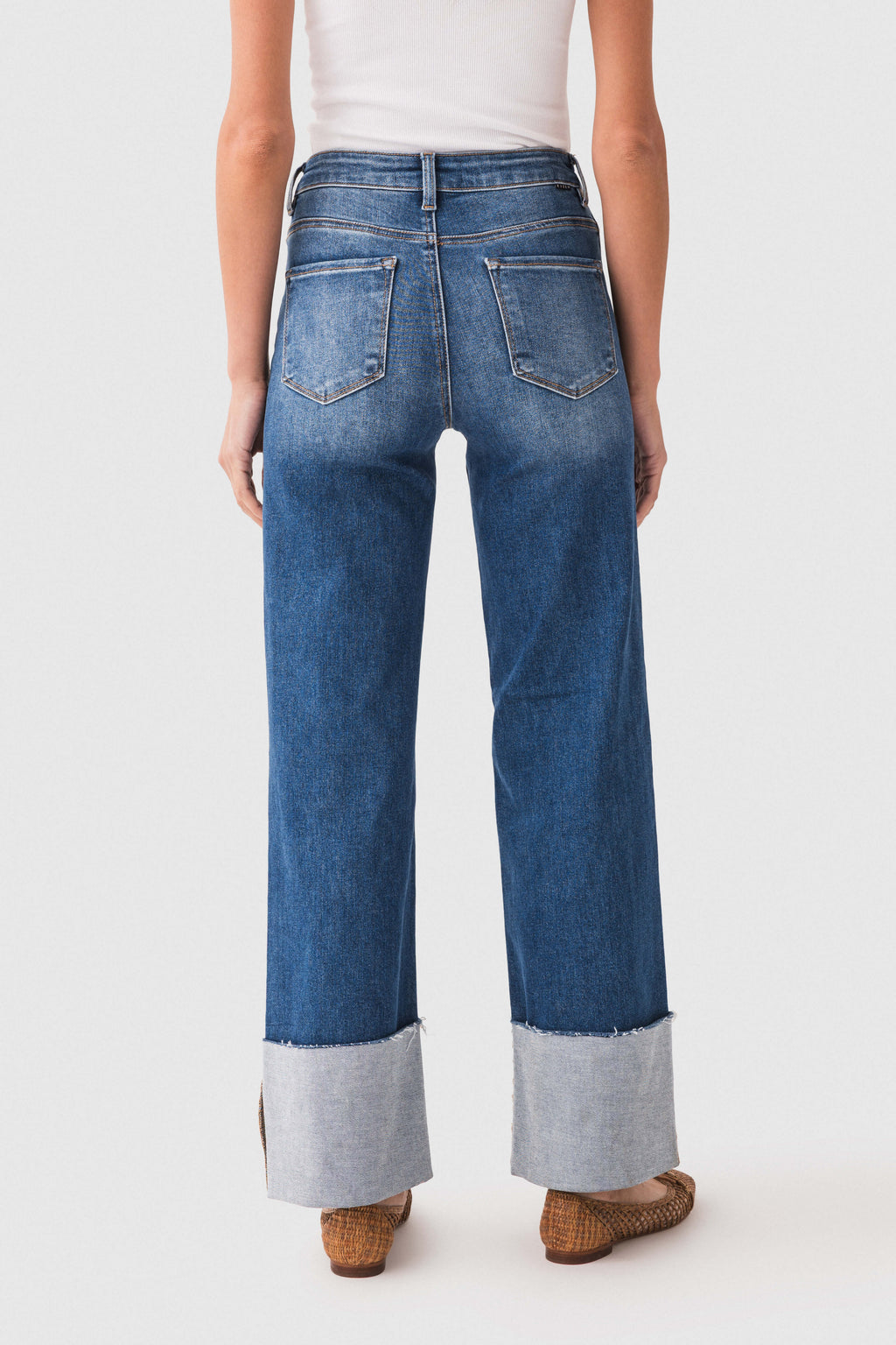 Risen Scout large-cuffed jeans, back view in dark blue denim with contrast cuff