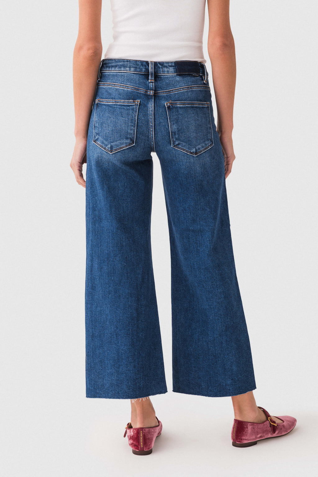 High-rise wide-leg dark wash denim jeans with back pockets and straight wide leg