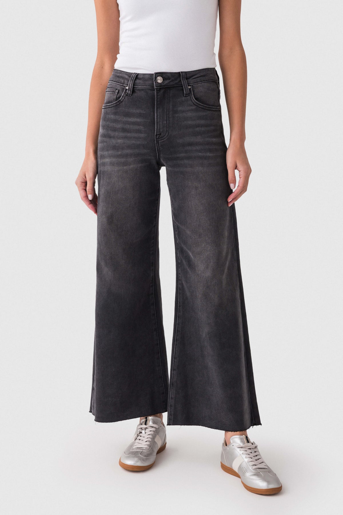 Washed black raw-hem palazzo jeans with wide legs and a button-and-zip front