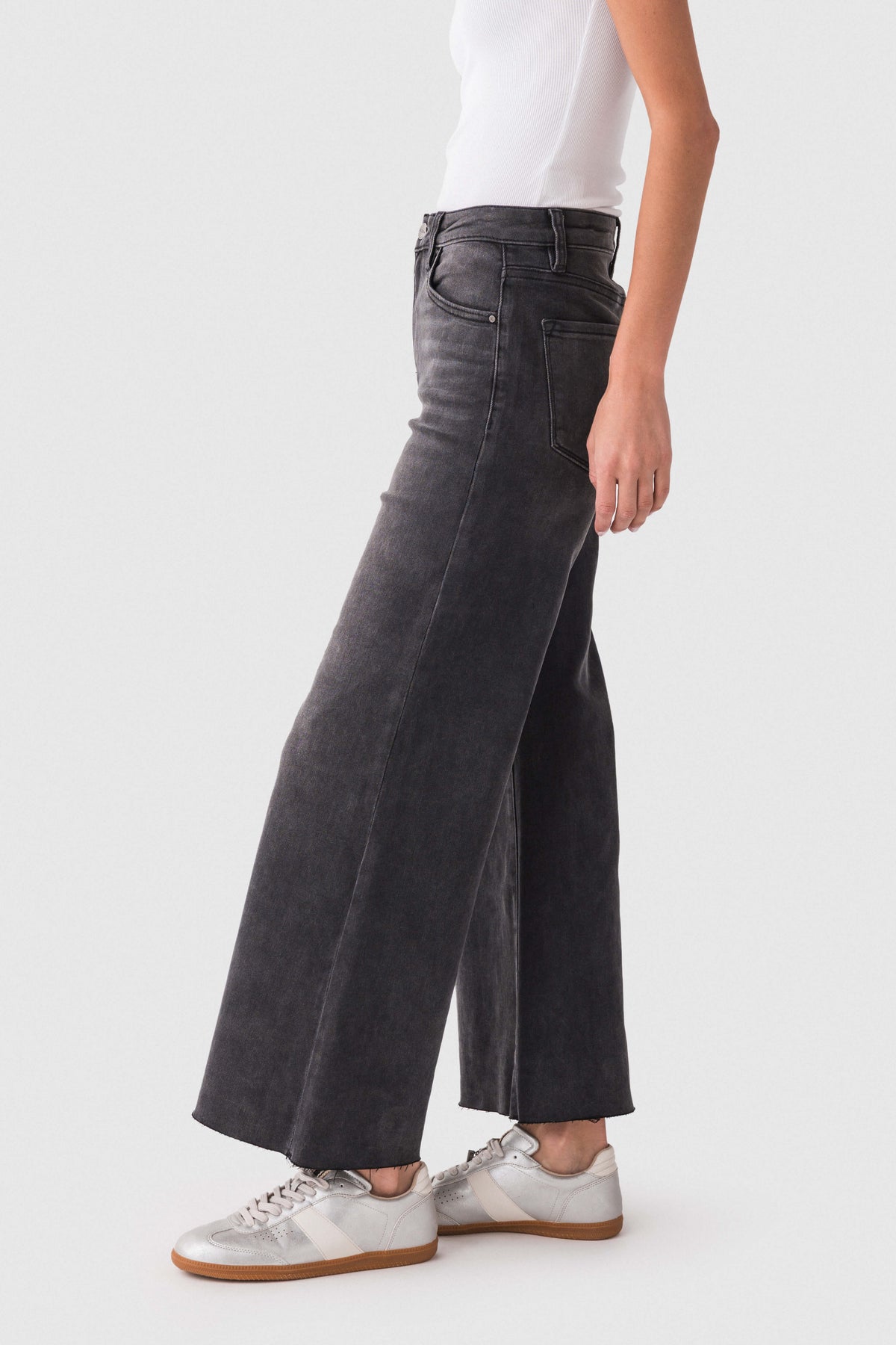 Dark wash raw-hem palazzo jeans, high-rise waistband, wide flare leg