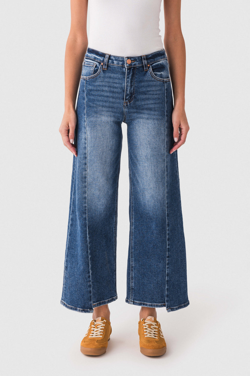 Dark blue high-rise barrel jeans with uneven hem and wide straight legs