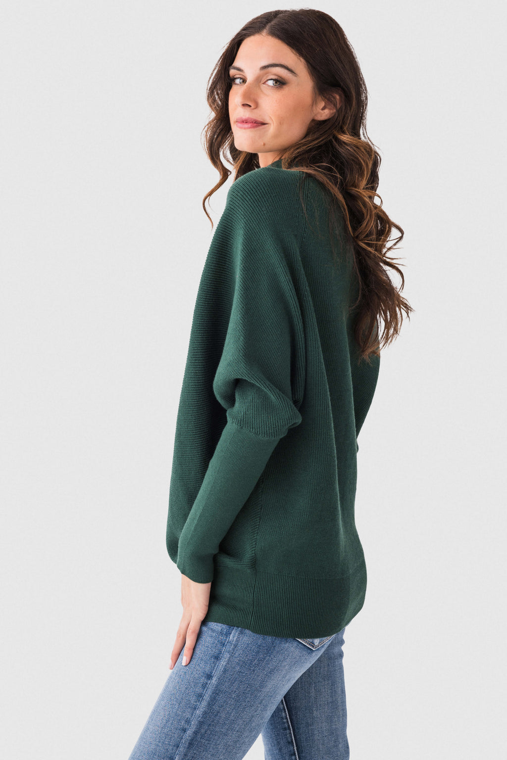 Olive green dolman pullover sweater with slouch neck and long sleeves, side view.