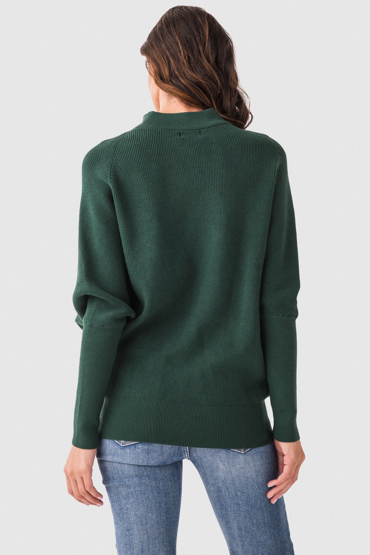 Hunter green dolman pullover sweater with slouch neck, long sleeves, back view.