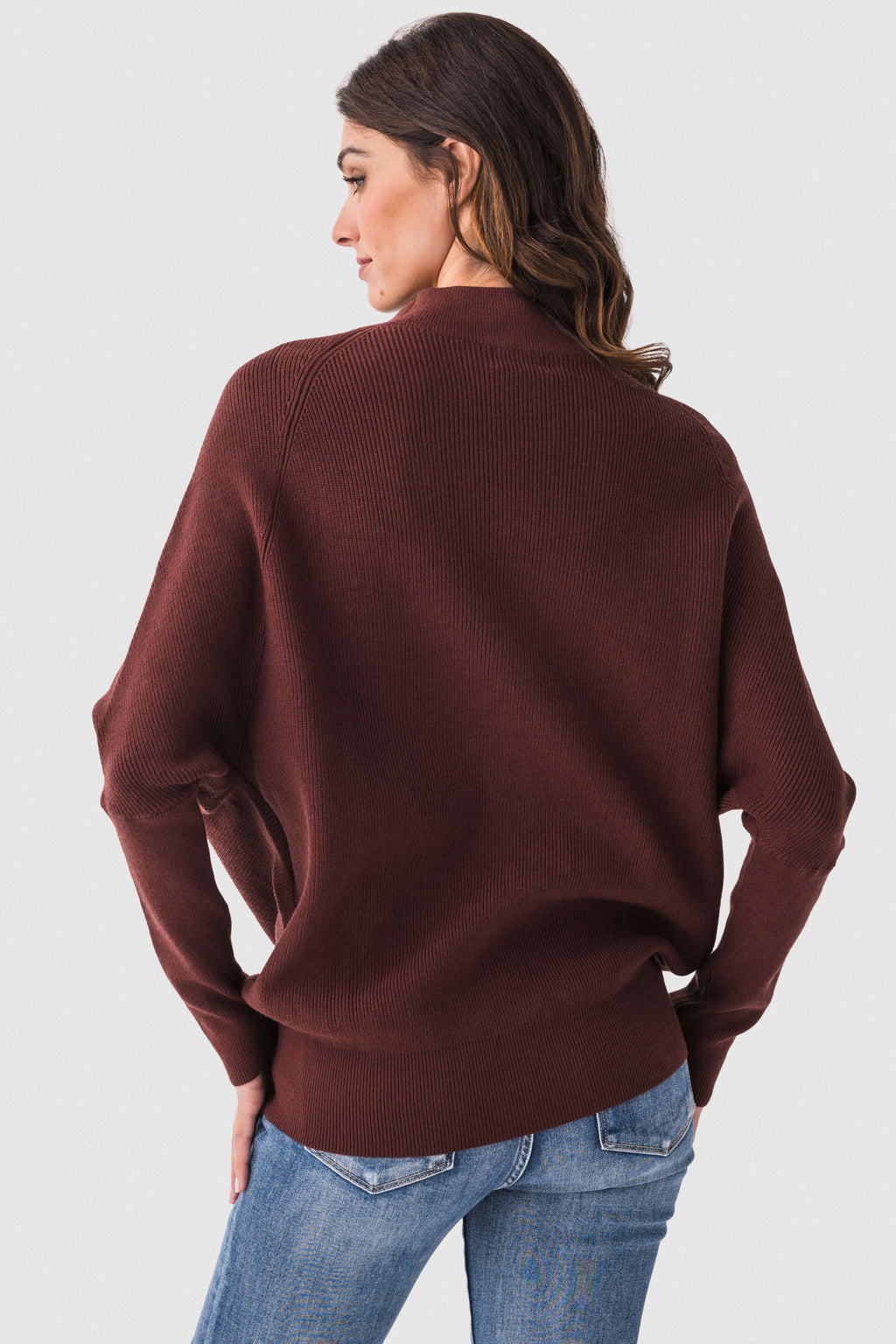 Chocolate brown dolman pullover sweater with slouch neck and long sleeves, back view.