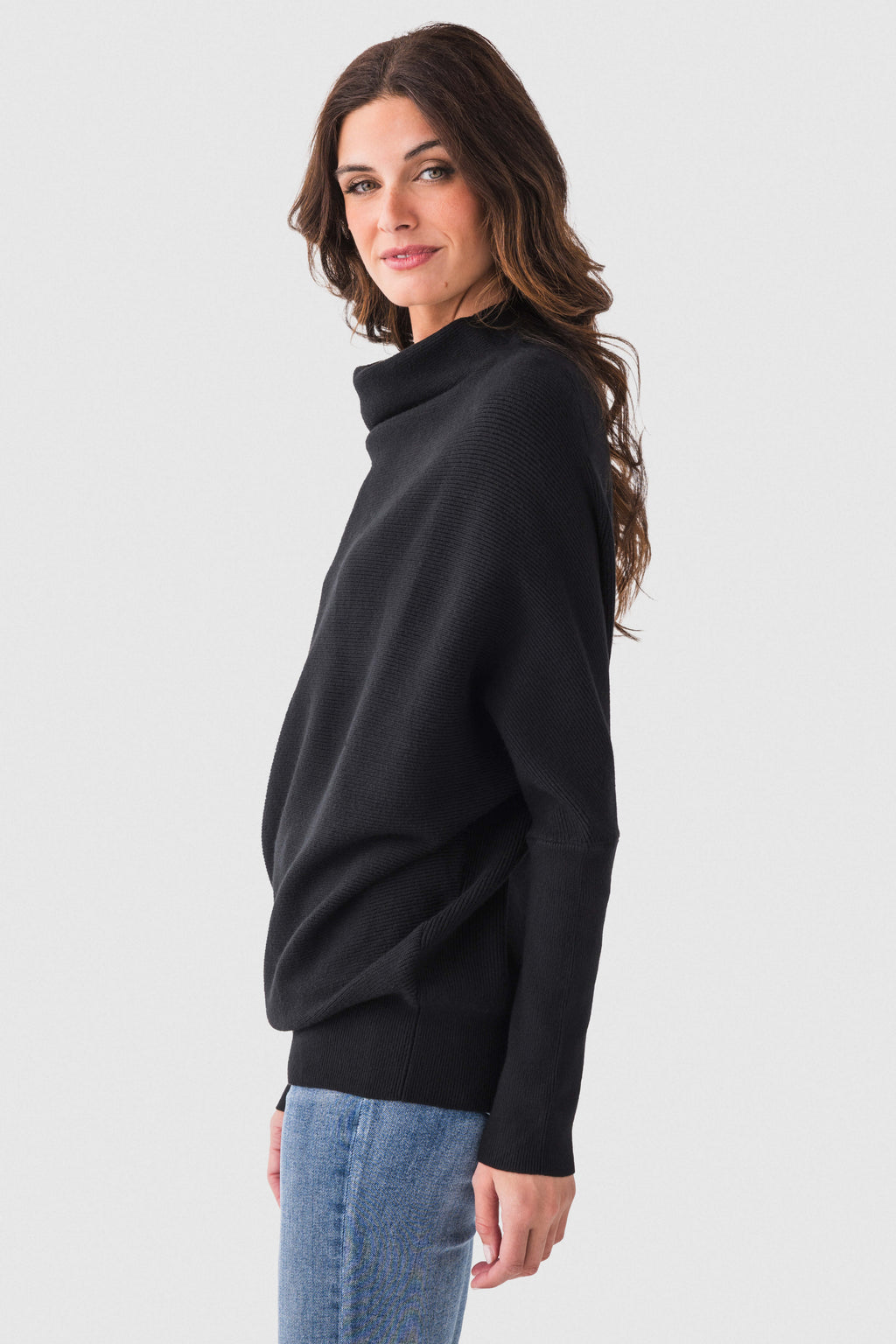 Black slouch-neck dolman pullover sweater with long sleeves and side profile