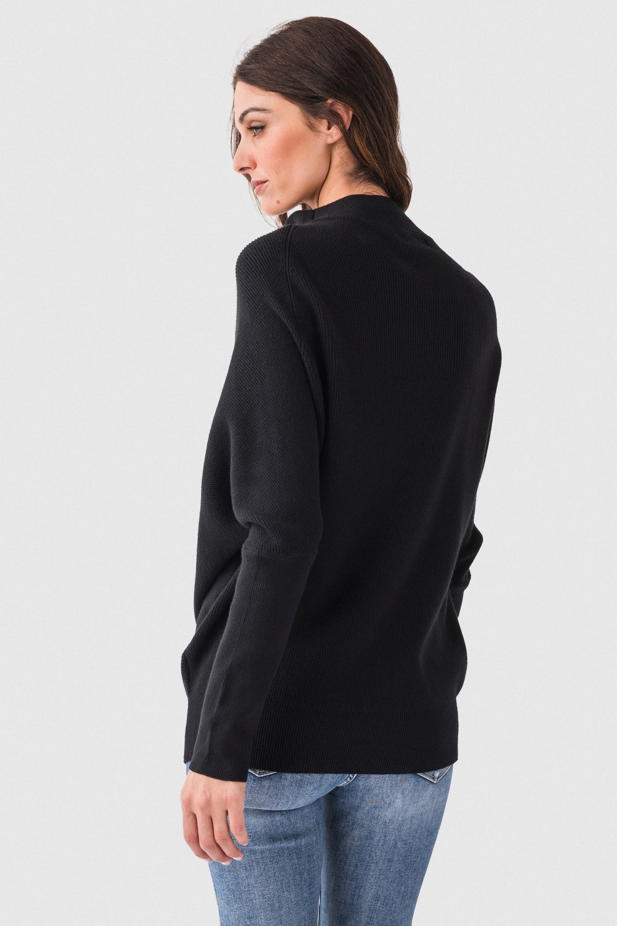 Black slouch-neck dolman pullover sweater with long sleeves and back view