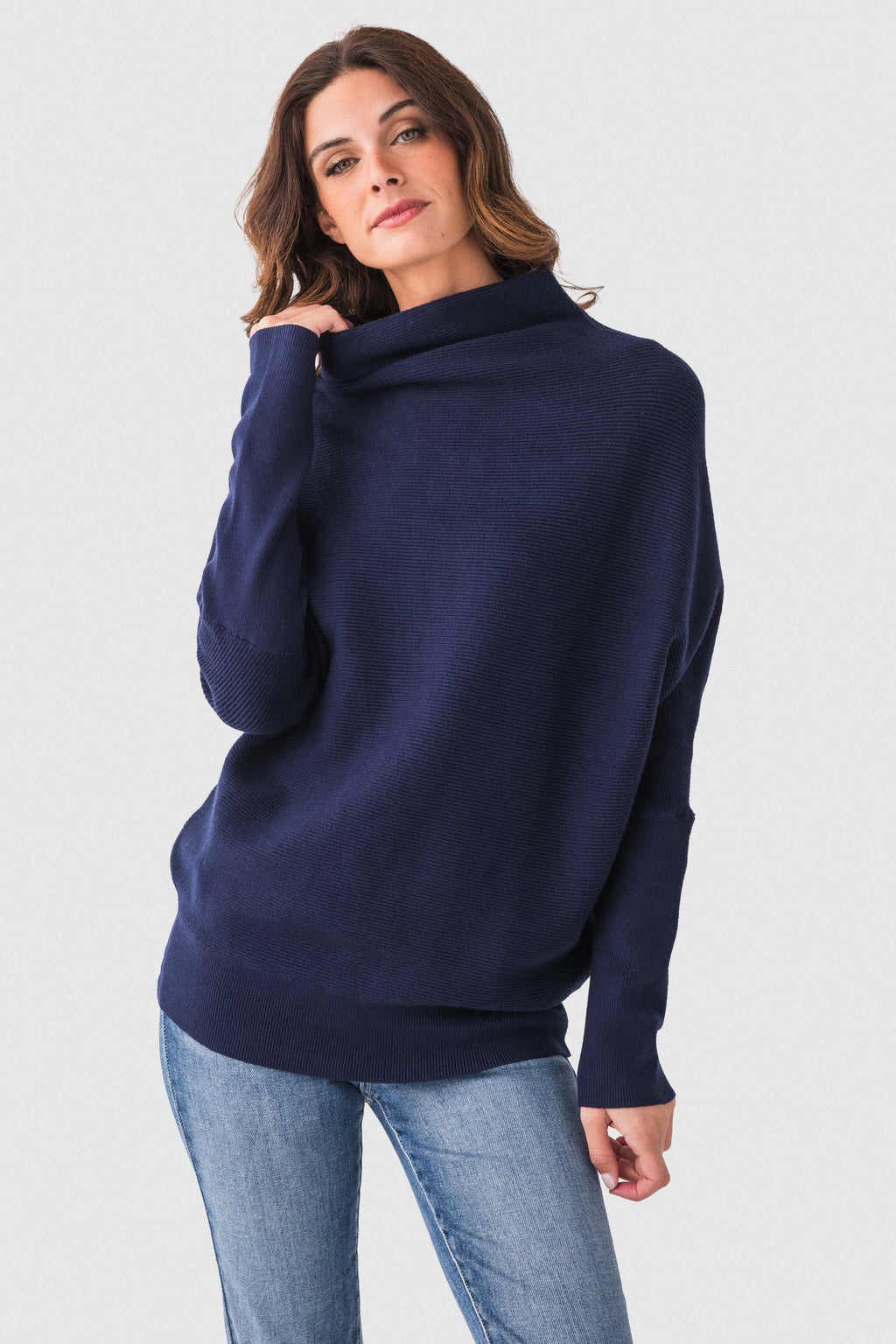 Navy dolman pullover sweater with slouch neck and long sleeves, front three-quarter view.