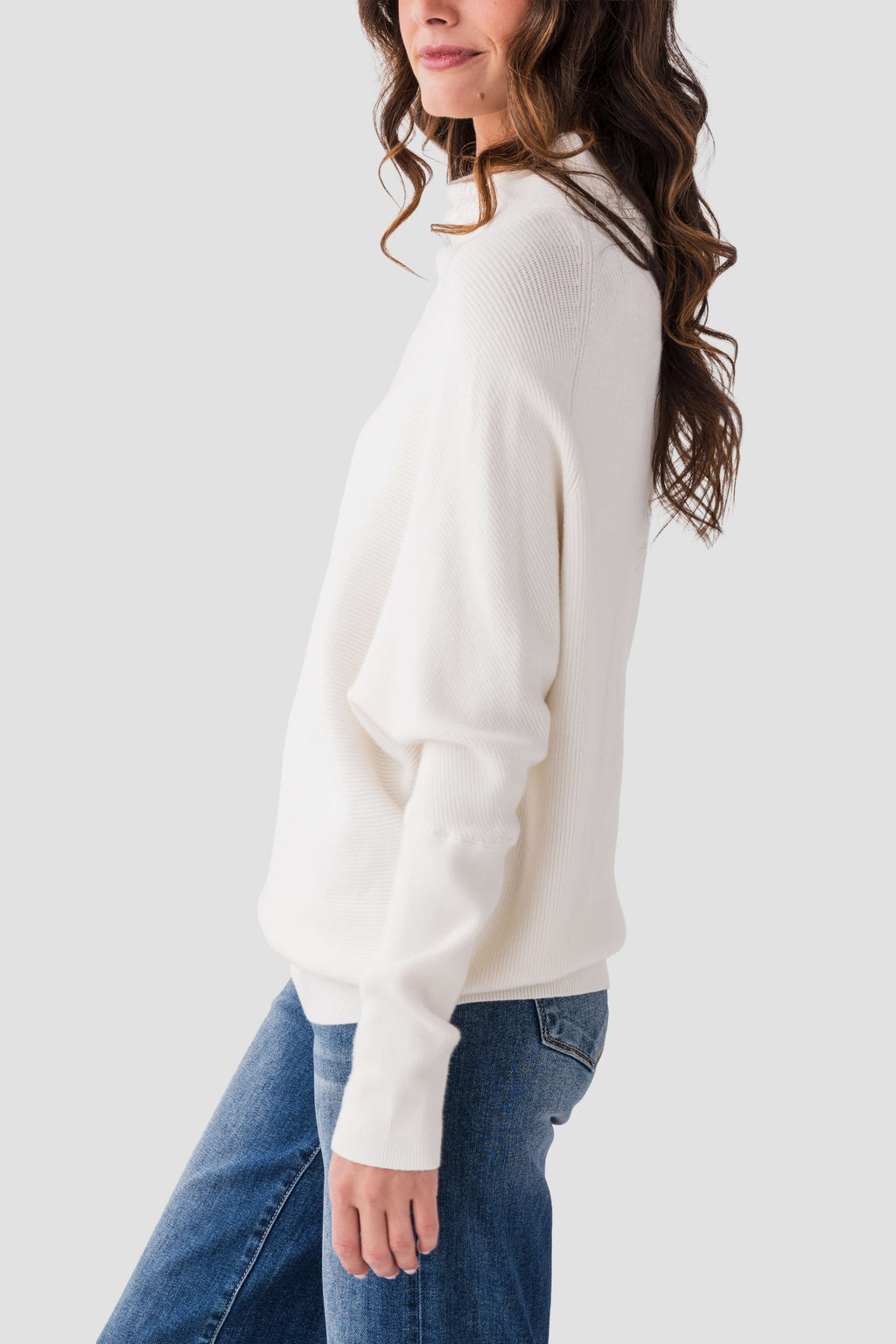 Cream slouch-neck dolman pullover sweater with long sleeves and relaxed drape