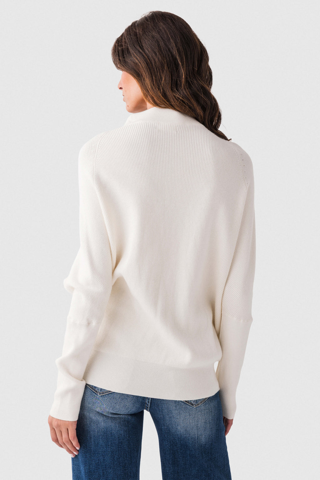 Cream slouch-neck dolman pullover sweater with long sleeves and back view