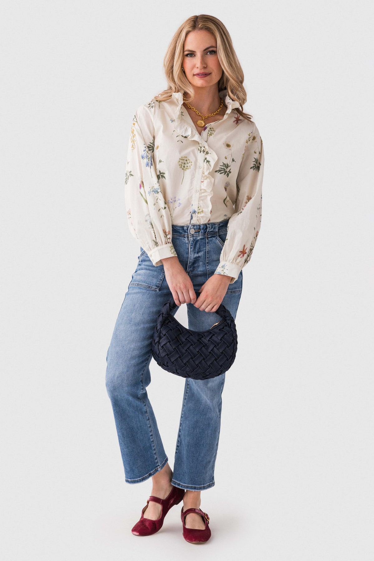 Medium blue ankle flare jeans front view with patch pockets and flared ankle hem
