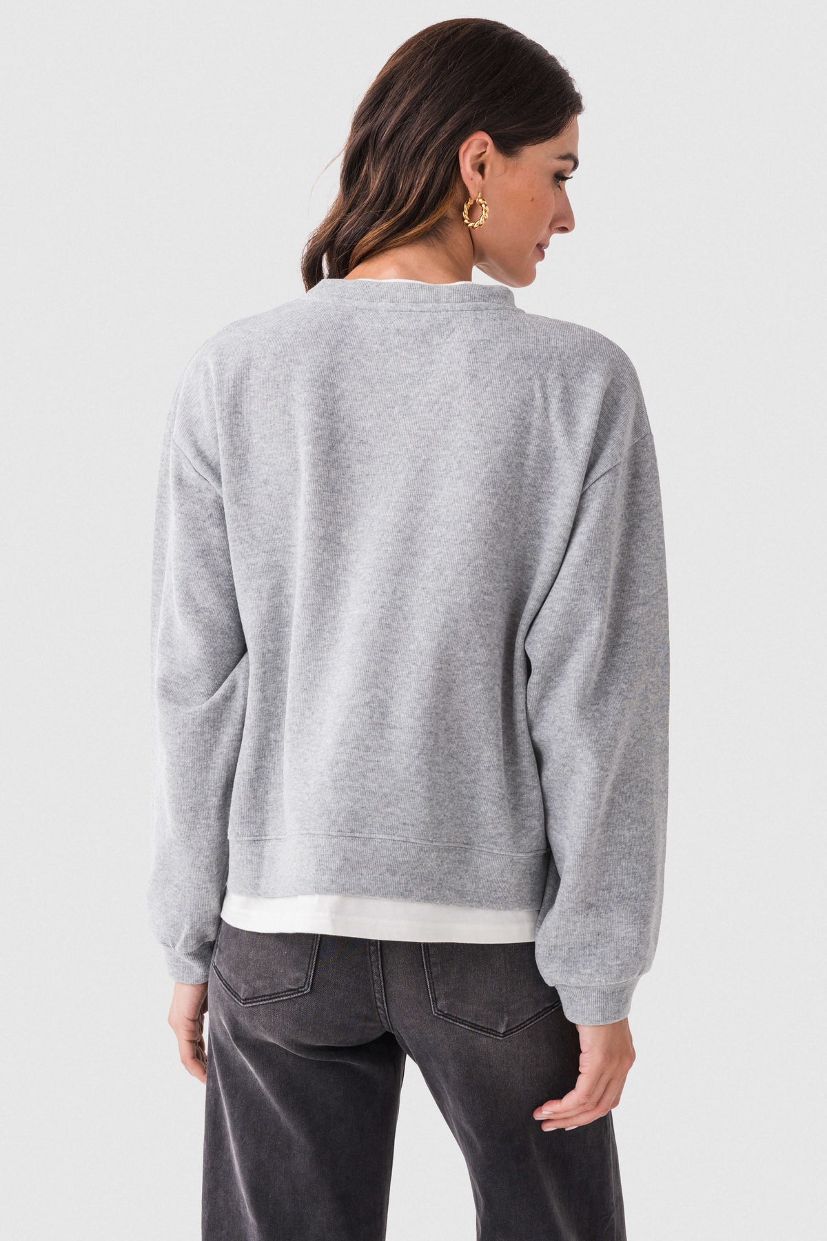 Heather gray crewneck pullover sweater shown from the back with long sleeves