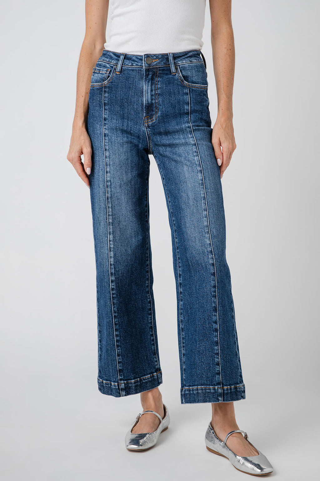 High-rise wide-leg ankle jeans in medium blue denim, front view with fly and seams