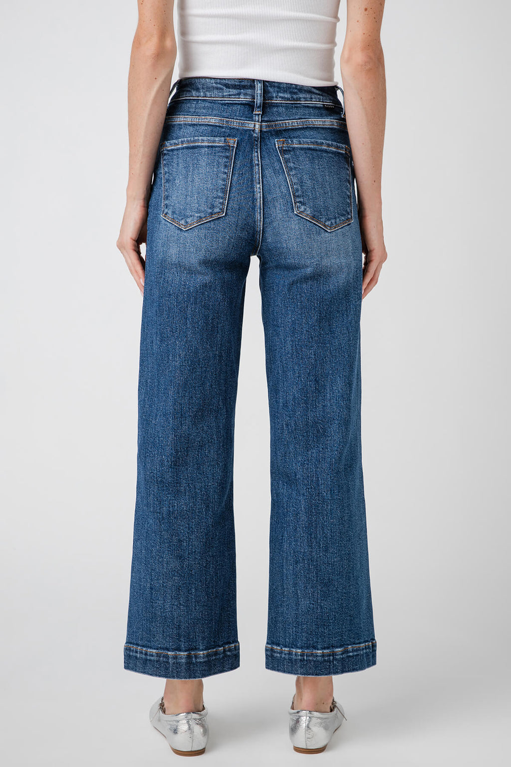 High-rise wide-leg ankle jeans in medium blue denim, back view with patch pockets