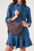 Wine woven half-moon crossbody bag with curved front and chain-style shoulder straps