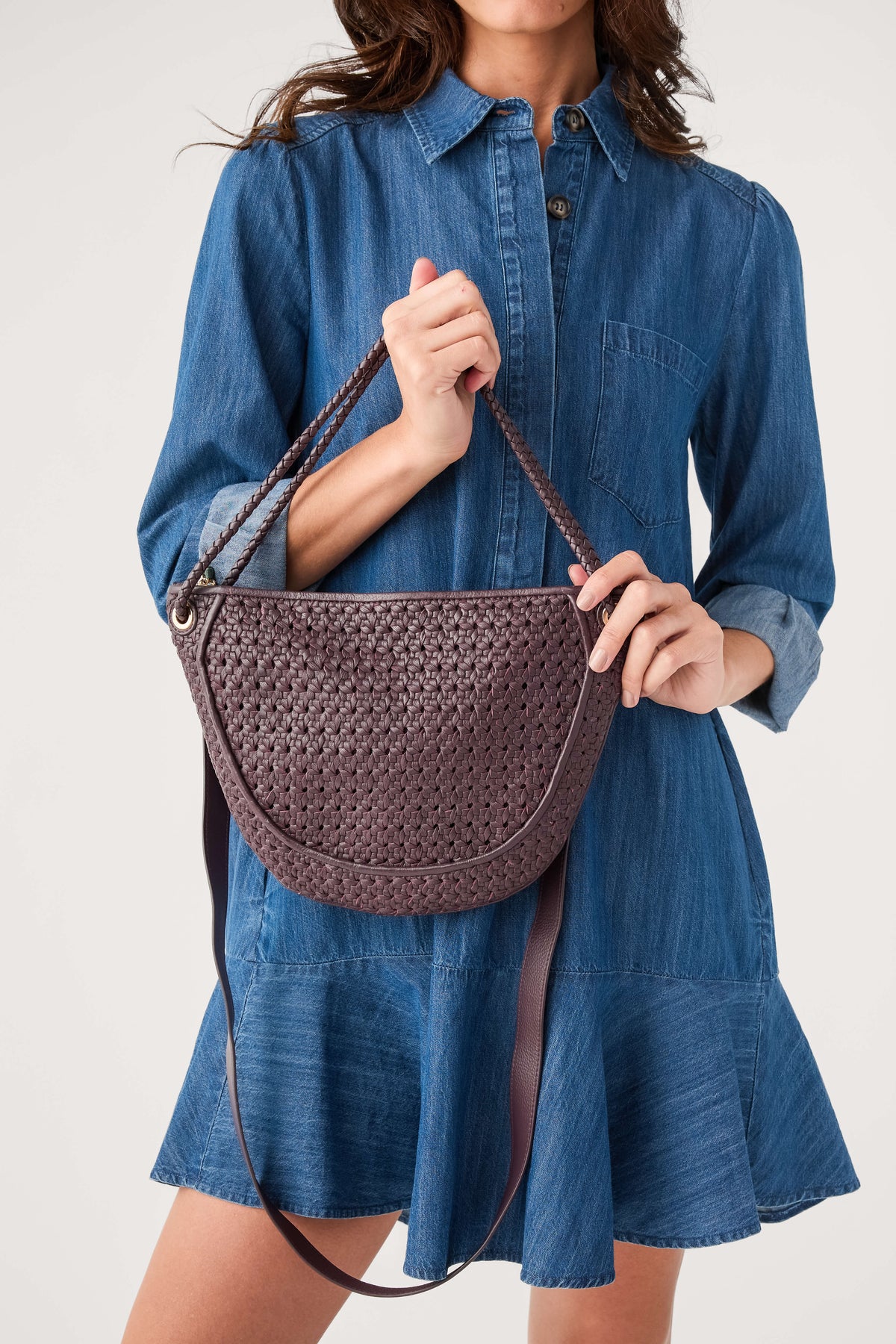 Wine woven half-moon crossbody bag with curved front and chain-style shoulder straps